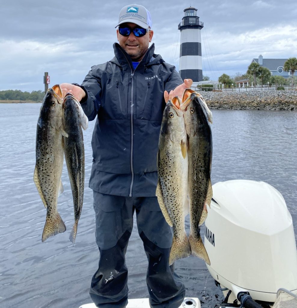 Captain Keith Logan preparing gear before an inshore fishing trip