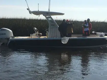 Inshore fishing charter boat preparing to fish calm coastal waters near Myrtle Beach