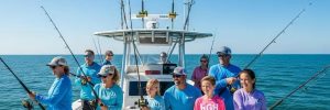 Fishing charter boat with families enjoying a day on the water near North Myrtle Beach