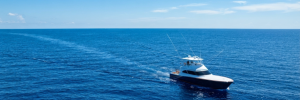Sport-fishing boat trolling on vivid blue Gulf Stream water off the Grand Strand