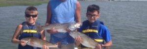 Private fishing charter group with red drum catch near North Myrtle Beach
