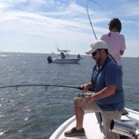 two people fighting redfish on a inshore fishing charter in myrtle beach